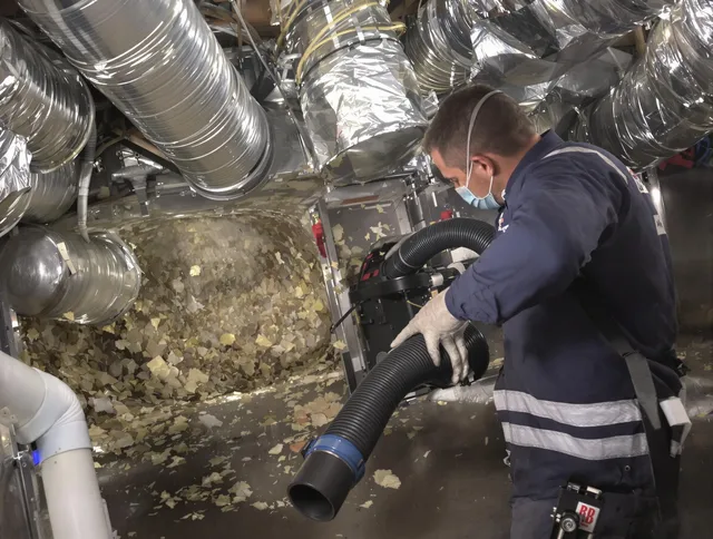 Bellingham Air Duct Cleaning specialist operating negative pressure cleaning equipment for thorough duct maintenance in Bellingham